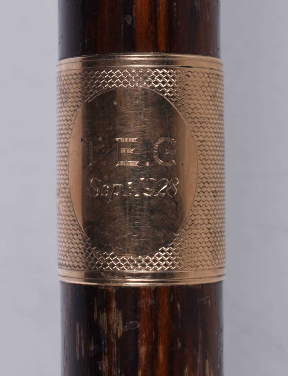 A wooden walking cane with a 9 Ct gold collar stamed 1928 together with another leather encased - Image 3 of 14