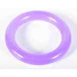 A Lavender Jade Bangle. 6 cm internal diameter, weight 89g