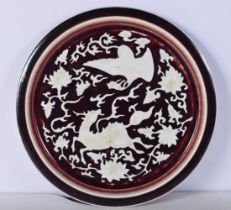 A Chinese porcelain dish decorated with animals and Phoenix in relief 30.5 cm