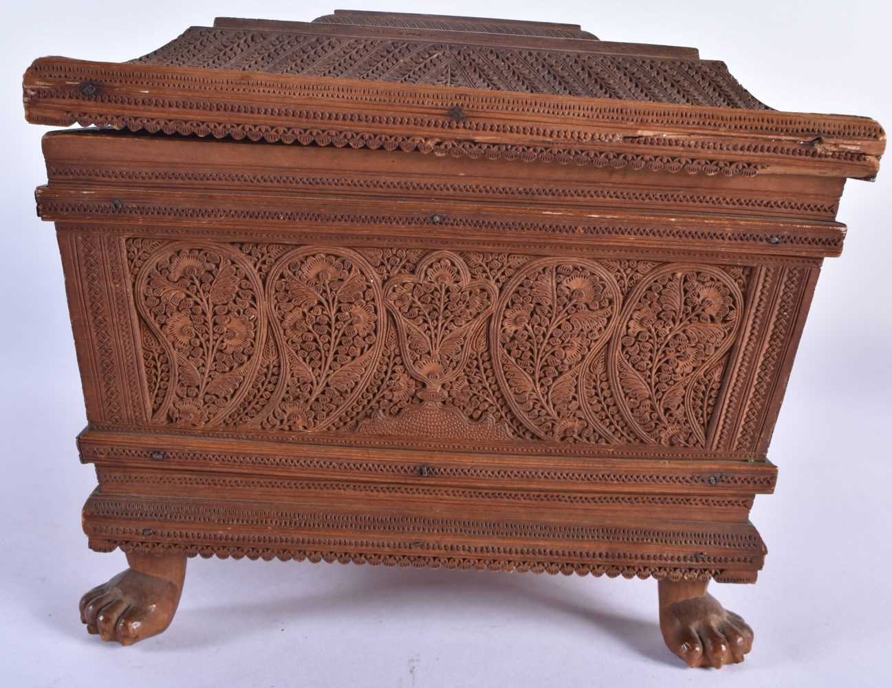 A FINE MID 19TH CENTURY ANGLO INDIAN CARVED WOOD CASKET AND COVER decorated with mythical birds, - Image 5 of 12