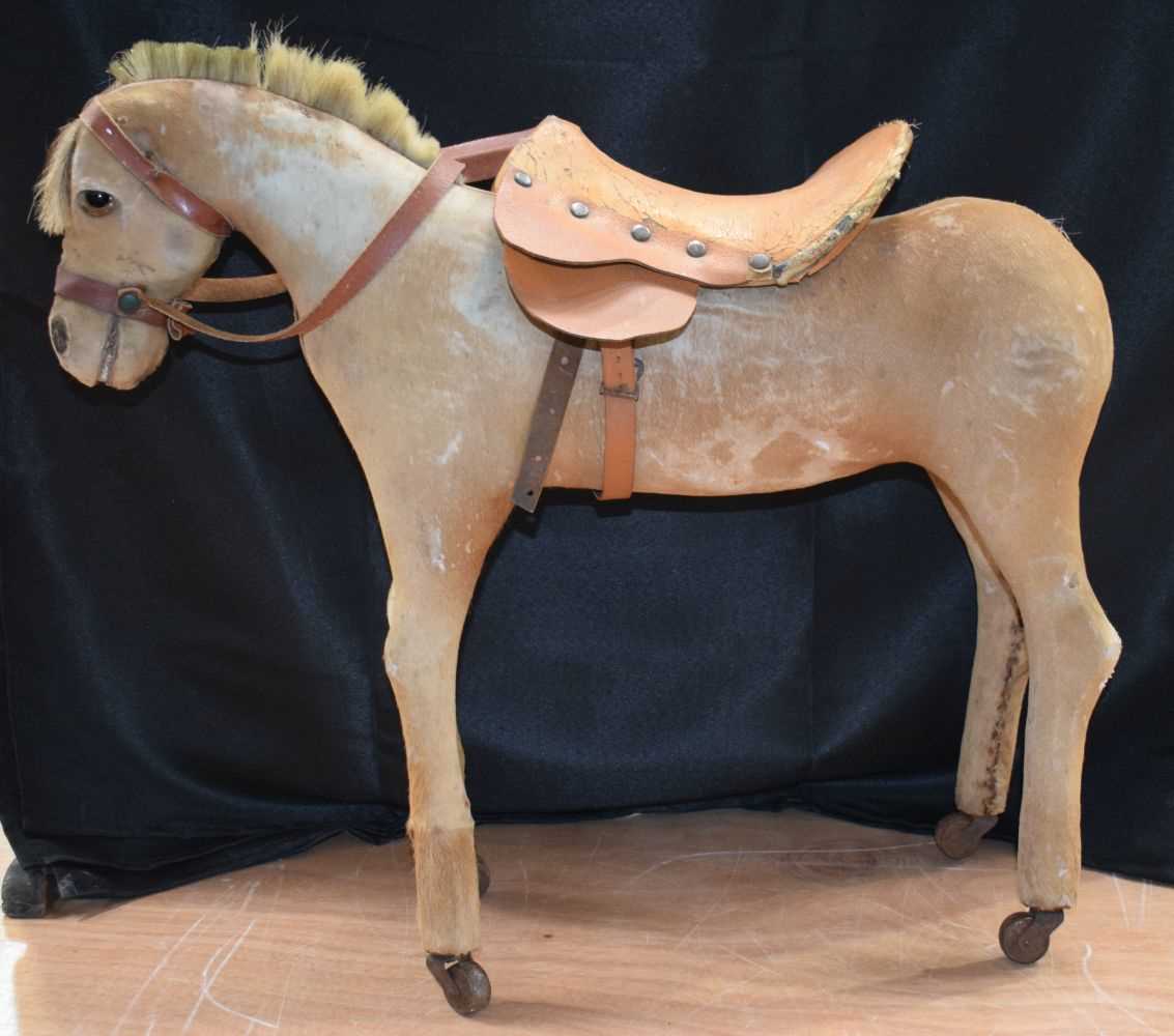 A Victorian hide covered pull along child's horse 55 x 62 cm. - Image 3 of 10