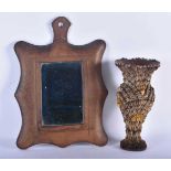 AN UNUSUAL ANTIQUE COUNTRY HOUSE SHELL OVERLAID POTTERY VASE together with a leather mirror. Largest