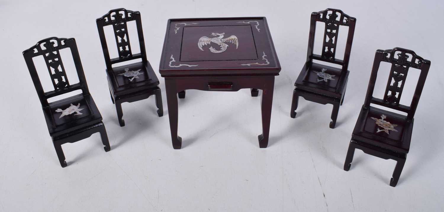 A Chinese miniature hardwood table and chairs with mother of pearl inlay together with a pair of - Image 5 of 10