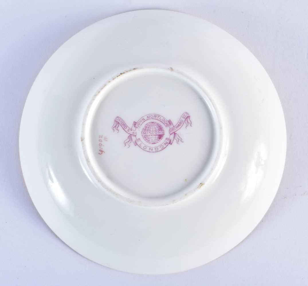 Minton teacup and saucer painted with a naked baby laying on a straw mattress, globe mark, made - Image 6 of 19