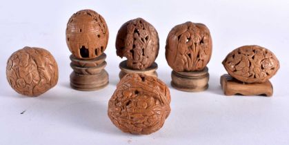 A COLLECTION OF 19TH/20TH CENTURY CHINESE CARVED NUTS Late Qing, in various forms and sizes. 5 cm