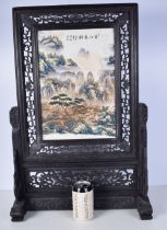 A Chinese Porcelain plaque decorated with landscape held in a fitted carved hardwood frame 67 x