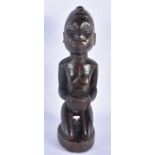 AN AFRICAN TRIBAL CARVED WOOD FERTILITY FIGURE. 28 cm high.