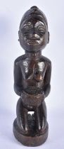AN AFRICAN TRIBAL CARVED WOOD FERTILITY FIGURE. 28 cm high.