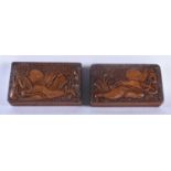 A PAIR OF 19TH CENTURY ANGLO INDIAN BURMESE ASIAN CARVED WOOD CASKETS decorated in relief with