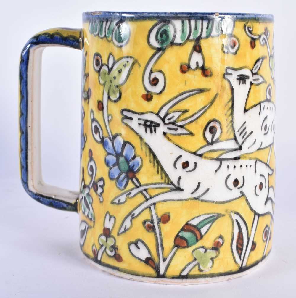 A MIDDLE EASTERN FAIENCE IZNIK JERUSALEM POTTERY MUG painted with leaping deer. 12 cm x 10 cm. - Image 3 of 6