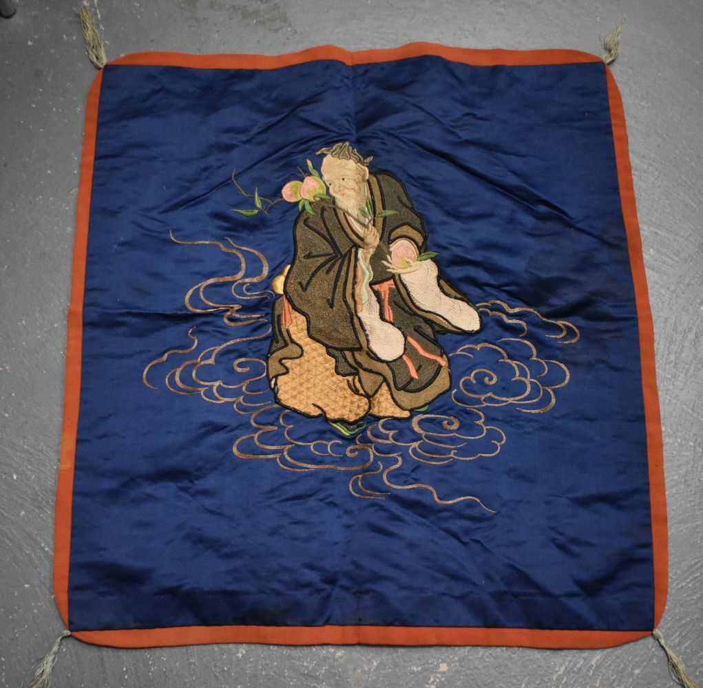 A Chinese Silk Panel of a Sage Holding a Peach Blossom. 68cm x 71cm