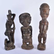 THREE TRIBAL CARVED AFRICAN FIGURES. Largest 34 cm high. (3)