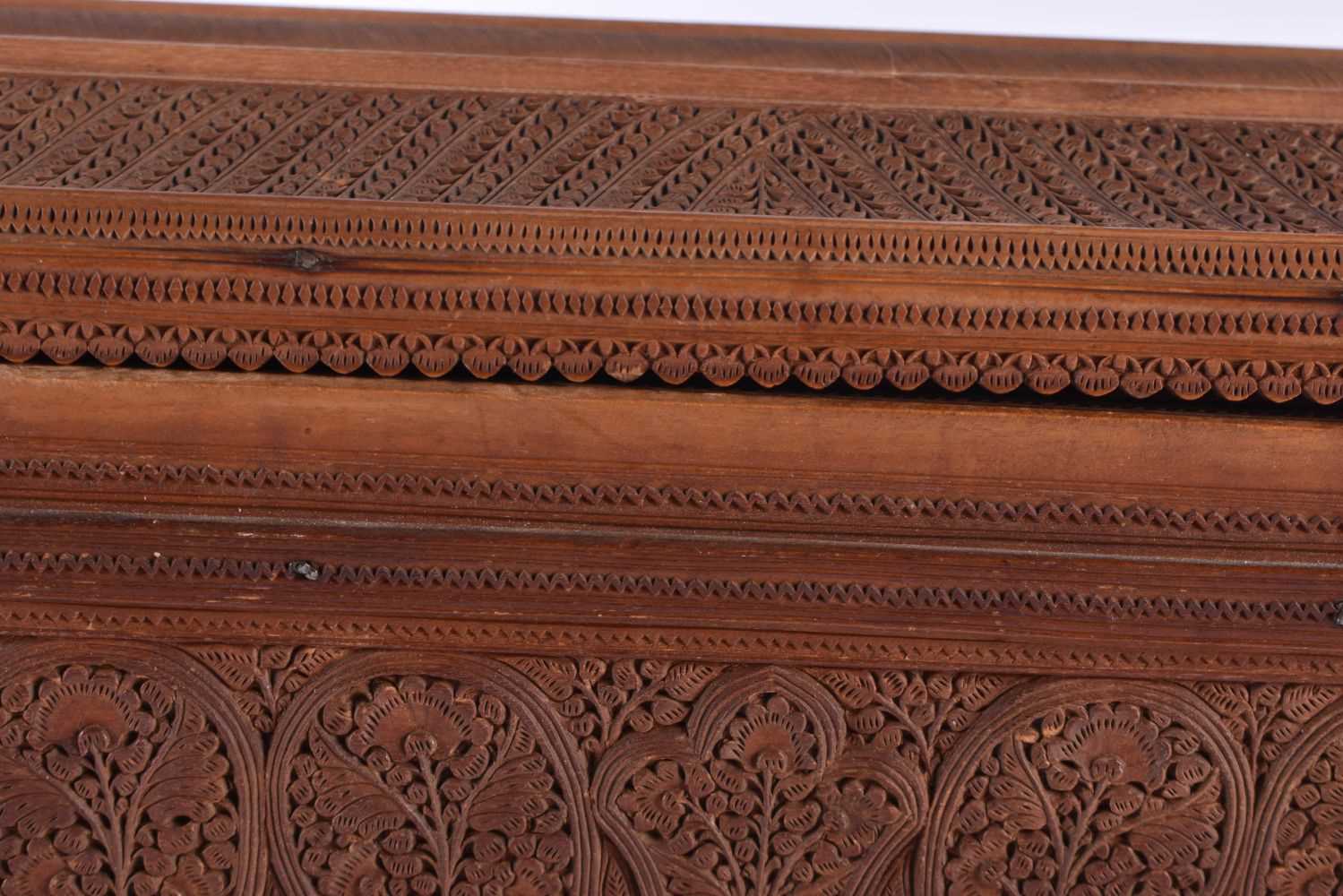 A FINE MID 19TH CENTURY ANGLO INDIAN CARVED WOOD CASKET AND COVER decorated with mythical birds, - Image 3 of 12