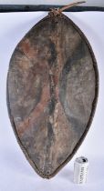 AN AFRICAN TRIBAL PAINTED HIDE SHIELD. 78 cm x 34 cm.