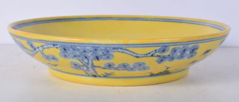 A Chinese porcelain dish decorated with trees to the interior 5 x 23.5 cm