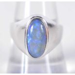 An 18 Carat White Gold Ring set with a Black Opal. Stamped 750, Size P, weight 5.1g