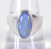 An 18 Carat White Gold Ring set with a Black Opal. Stamped 750, Size P, weight 5.1g