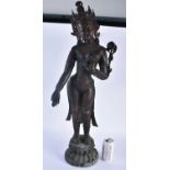 A LARGE 19TH CENTURY INDIAN TIBETAN BRONZE FIGURE OF A STANDING DEITY modelled upon a leaf form