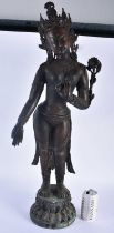 A LARGE 19TH CENTURY INDIAN TIBETAN BRONZE FIGURE OF A STANDING DEITY modelled upon a leaf form