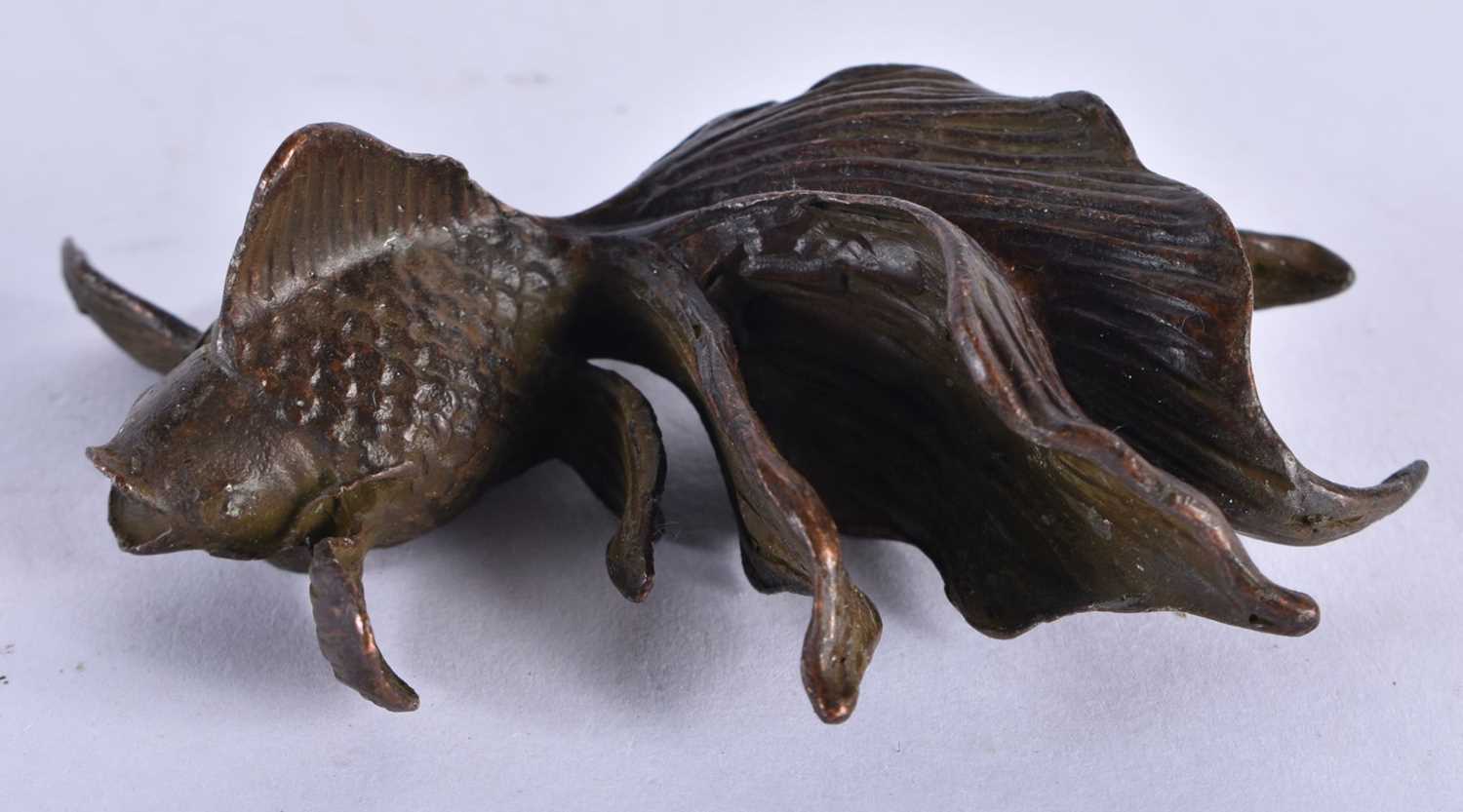 A JAPANESE BRONZE GOLDFISH OKIMONO.110.7 grams. 8 cm x 5.5 cm.