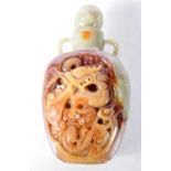 A Two Tone Carved Jade Snuff Bottle. 7.8 cm x 4.2 cm x 2.6 cm