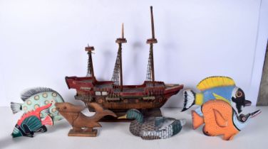 A Wooden model of a Gallon together with a collection of wooden fish and a duck 41 x 51 cm (7).