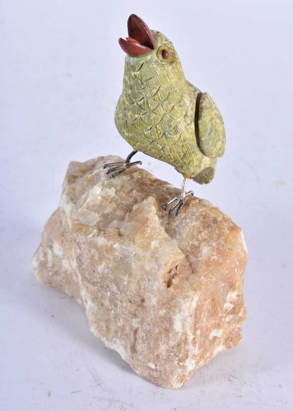 A Carved Hardstone Model of a Bird with Silver Feet Perched on a Rock. 13 cm x 13 cm x 4.5 cm - Image 2 of 3