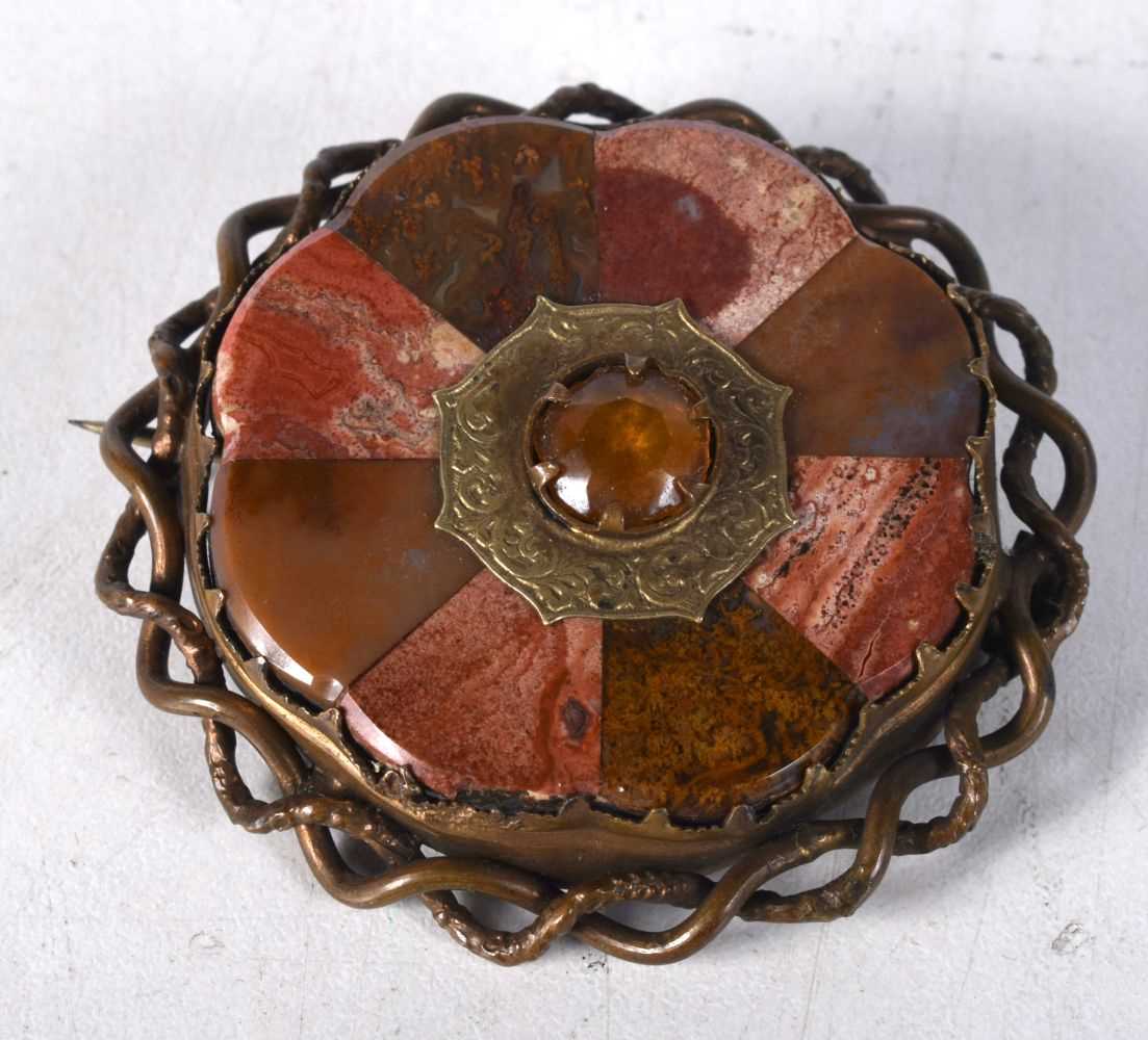 A Victorian Scottish Agate Brooch set with a centre gemstone. 5.6 cm diameter, weight 27.1g