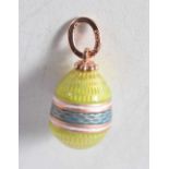 A Continental Enamel Egg Pendant with Gold Mounts. Stamped 56. 1.9cm x 1.1cm, weight 2.6g