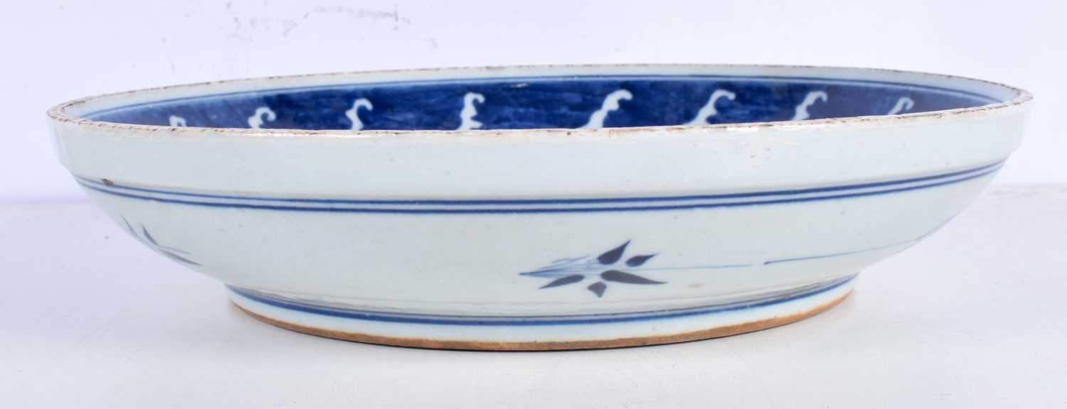 A Chinese Porcelain blue and white dish decorative with a figure riding ab fish 6 x 29 cm. - Image 3 of 6