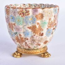 A 19TH CENTURY JAPANESE MEIJI PERIOD SATSUMA FLUTED TEABOWL painted with hundreds of butterflies.