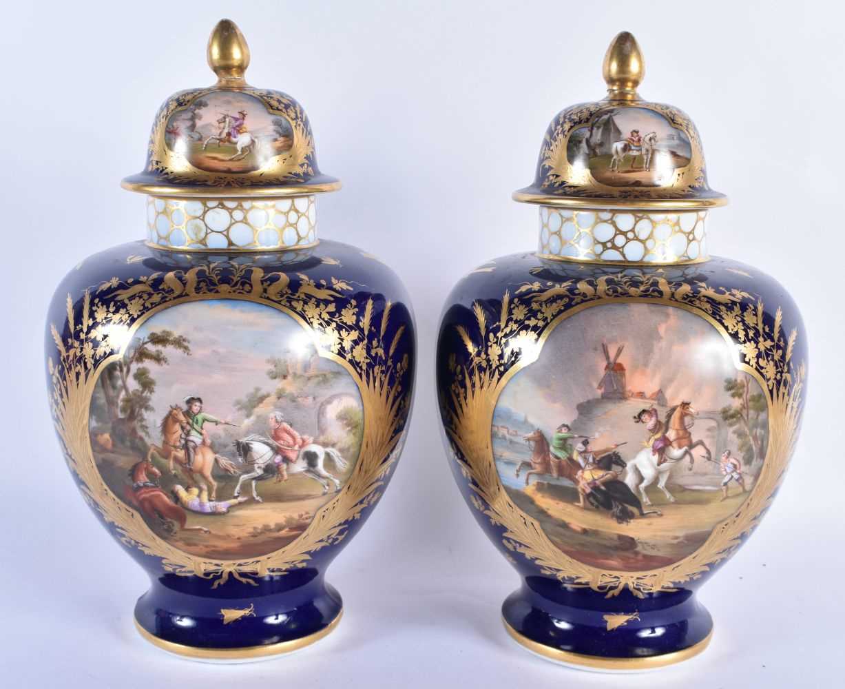 A LARGE PAIR OF 19TH CENTURY GERMAN DRESDEN PORCELAIN VASES AND COVERS painted with fighting - Image 3 of 5