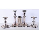 A pair of Silver plated candlesticks together with a smaller pair largest 20 cm (4).