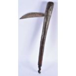 A TRIBAL CARVED WOOD AXE. 55 cm long.