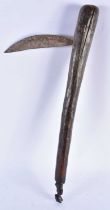 A TRIBAL CARVED WOOD AXE. 55 cm long.