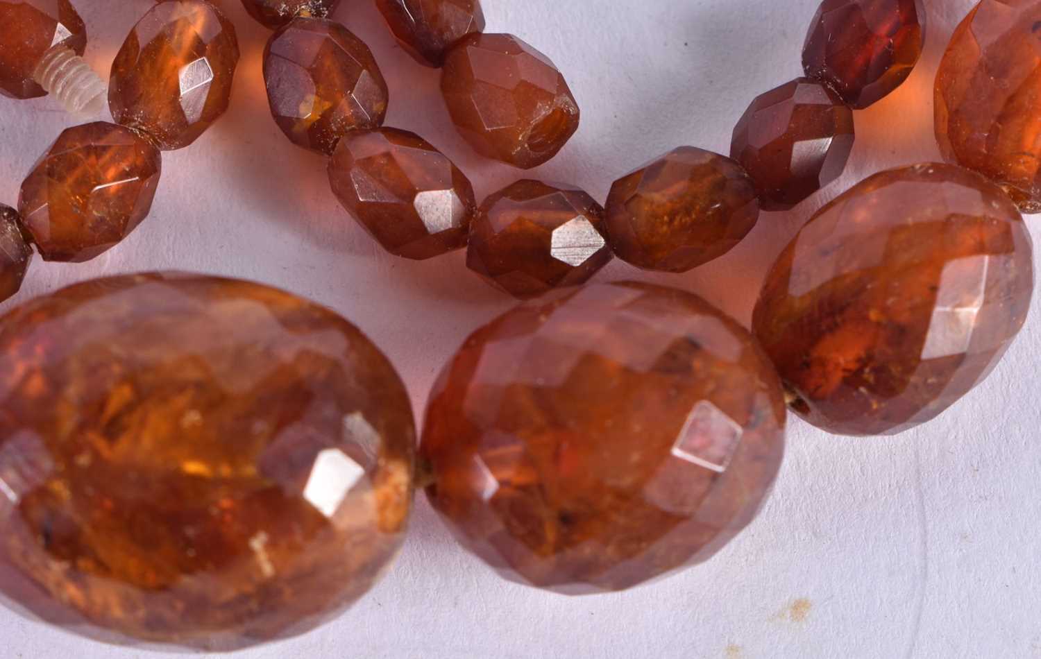 A Faceted Amber Bead Necklace. 58cm long, largest Bead 20mm, weight 35g - Image 3 of 3