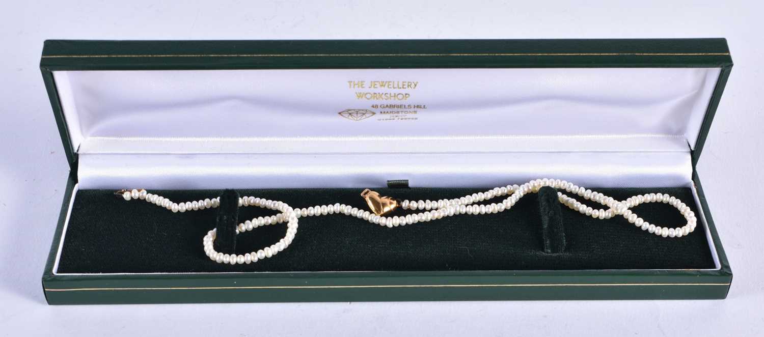 A 9CT GOLD MOUNTED PEARL NECKLACE. 6 grams. 41 cm long.