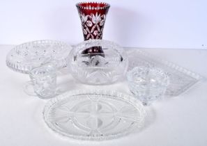 A collection of lead crystal glass items together with a Bohemian overlay glass vase largest 26cm