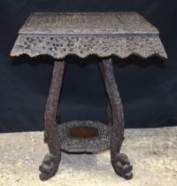 A 19th Century Anglo Indian/Burmese carved hardwood two tiered table 54 x 34 x 45cm