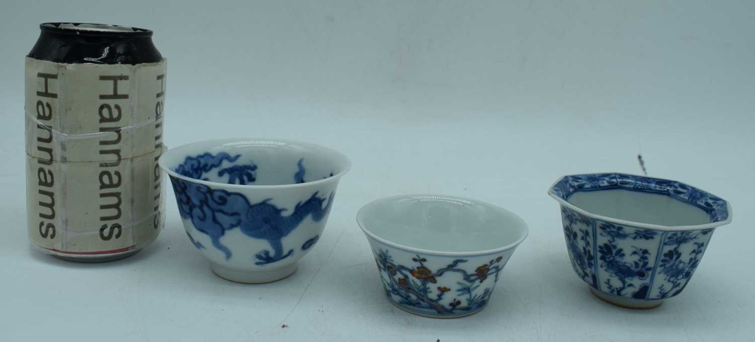 A small Chinese porcelain blue and white dragon bowl with two small bowls 6 x 9 cm. (3) - Image 2 of 6