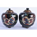 A PAIR OF 19TH CENTURY JAPANESE MEIJI PERIOD CLOISONNE ENAMEL JARS AND COVERS decorated with