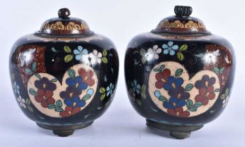 A PAIR OF 19TH CENTURY JAPANESE MEIJI PERIOD CLOISONNE ENAMEL JARS AND COVERS decorated with