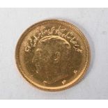 `1/4 Pahlavi Mohammad Reza Shah Gold Coin 1335 (1956).  1.9cm diameter, weight 4g