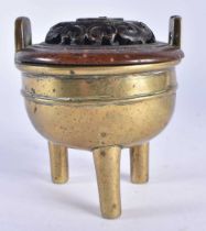 A 19TH CENTURY CHINESE TWIN HANDLED BRONZE QING CENSER, with hardwood cover. 11cm x 9 cm.