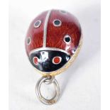 A Continental Silver Gilt and Enamel Egg Pendant with Ladybird Design. Stamped 84. 2 cm x 1.4cm,