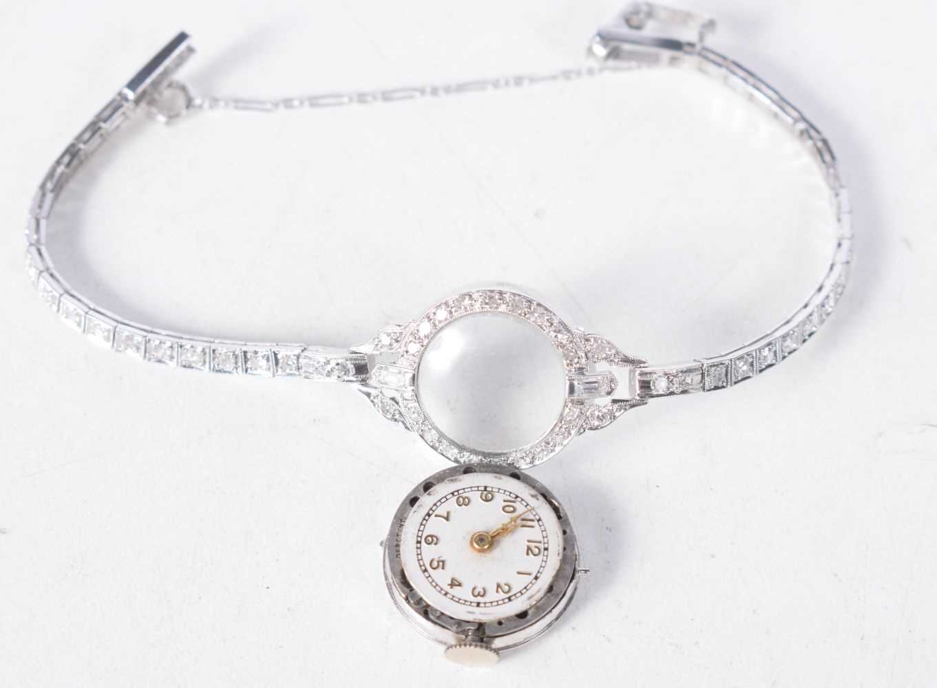 A Platinum Ladies Cocktail Watch set with diamonds. Stamped 10% IDID.PLAT. Length 13.5 cm, Dial 1.