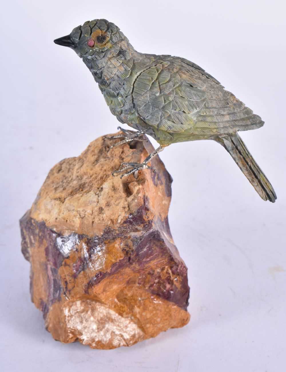 A Carved Hardstone Model of a Bird with Silver Feet Perched on a Rock. 13 cm x 13 cm x 4.5 cm - Image 2 of 3