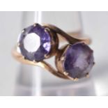 An Antique Gold Crossover Ring set with Two Amethyst. Size N, weight 4.6g