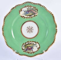 Flight Barr and Barr fine plate with green ground painted fancy birds in mirror shaped panels by ‘