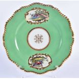 Flight Barr and Barr fine plate with green ground painted fancy birds in mirror shaped panels by ‘